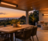 Ceiling and wall-mounted infrared heaters warming separate areas of a covered patio